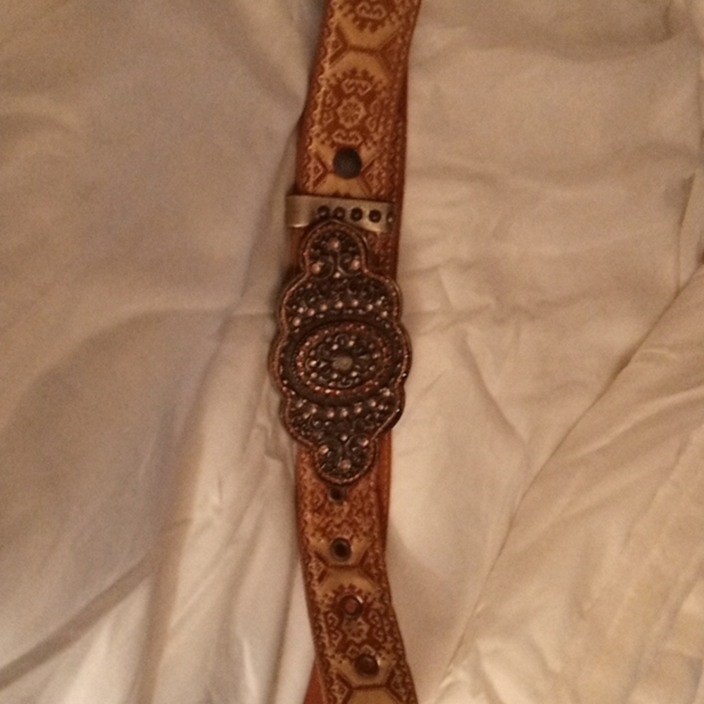 Beautiful statement buckle belt by Cache. great with some jeans and cowboy boots